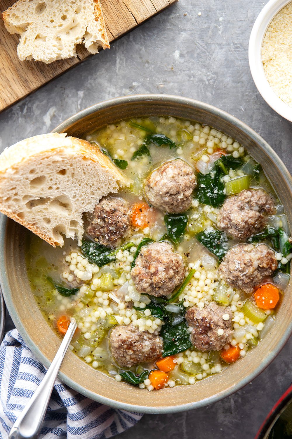 This hearty Italian wedding soup is packed full of juicy Italian sausage meatballs, tender pasta, and lots of veggies in a rich broth. Top bowls with lots of Parmesan and serve with thick bread slices for dipping.