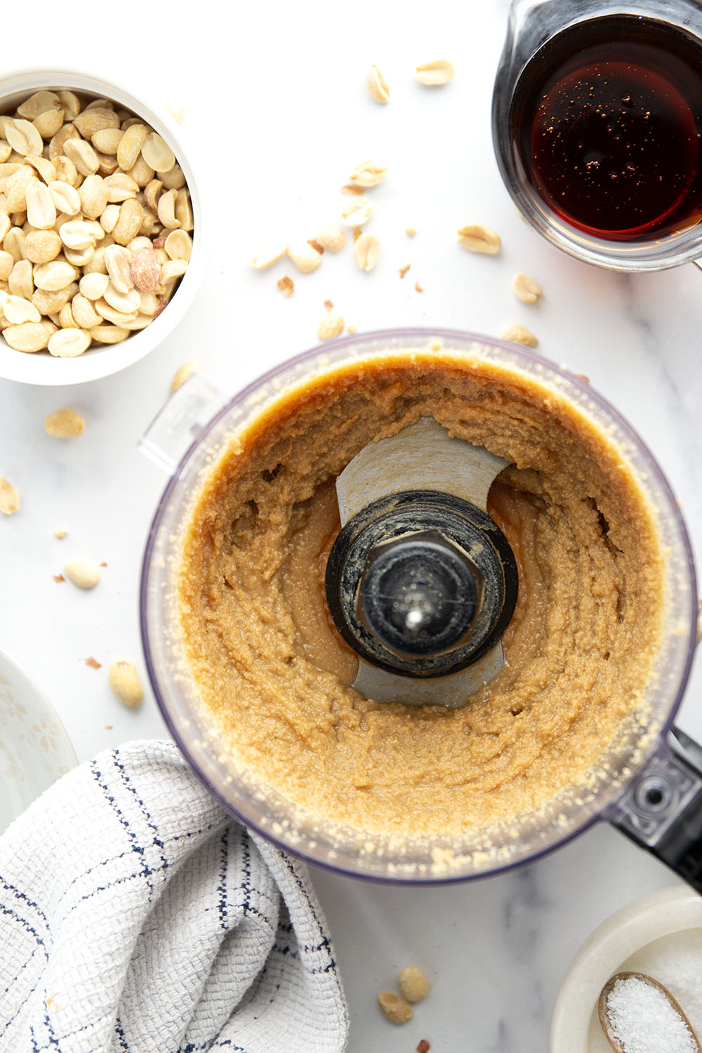 You'll never go back to jarred peanut butter after one taste of this smooth, creamy homemade maple peanut butter, that's lightly flavored with maple syrup, vanilla, and a touch of cinnamon.