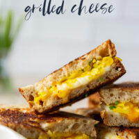 This breakfast-style scrambled egg grilled cheese is loaded to the max with scrambled eggs and two kinds of gooey cheese.