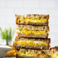 This breakfast-style scrambled egg grilled cheese is loaded to the max with scrambled eggs and two kinds of gooey cheese.