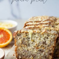 This tropical banana bread features a perfectly soft and dense texture and is packed with flaked coconut, lots of pineapple, and topped with a sweet citrus glaze.