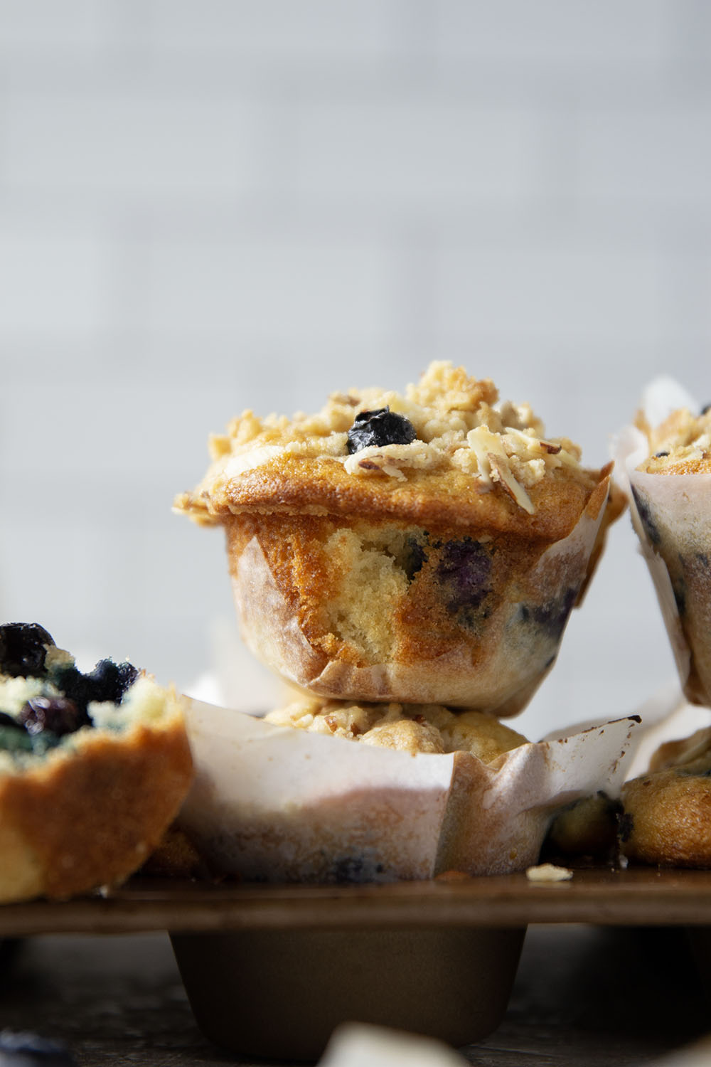 These big bakery-style blueberry almond streusel muffins will be the star of your brunch! Supremely moist inside, loaded with juicy blueberries and topped with a buttery almond topping.
