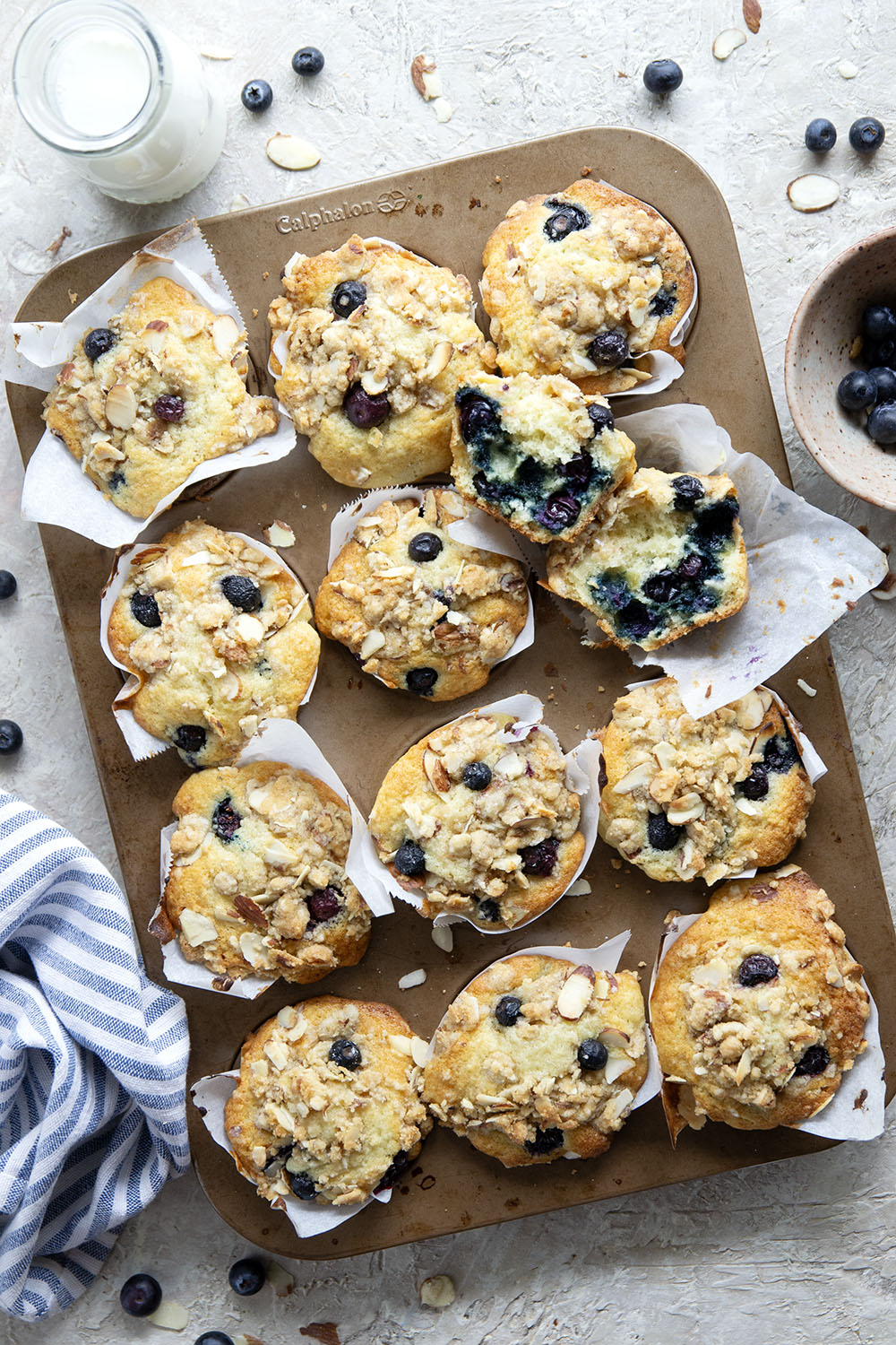 These big bakery-style blueberry almond streusel muffins will be the star of your brunch! Supremely moist inside, loaded with juicy blueberries and topped with a buttery almond topping.