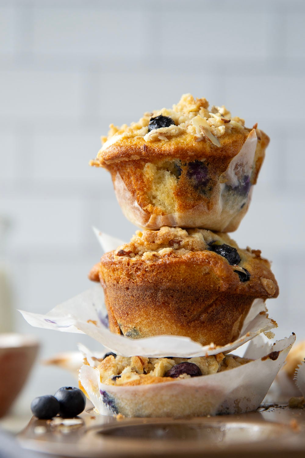 These big bakery-style blueberry almond streusel muffins will be the star of your brunch! Supremely moist inside, loaded with juicy blueberries and topped with a buttery almond topping.