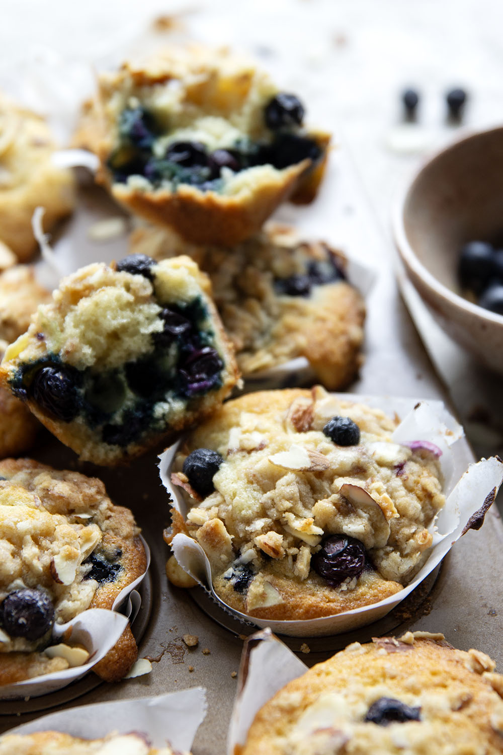 These big bakery-style blueberry almond streusel muffins will be the star of your brunch! Supremely moist inside, loaded with juicy blueberries and topped with a buttery almond topping.