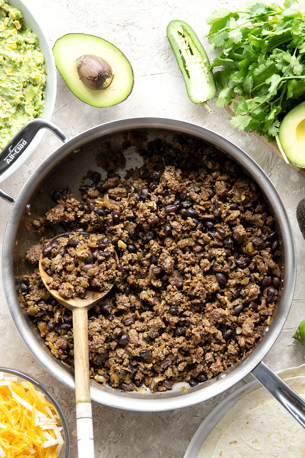 These ground beef quesadillas feature a cheesy ground beef black bean filling and lots of sweet corn guacamole for dipping.