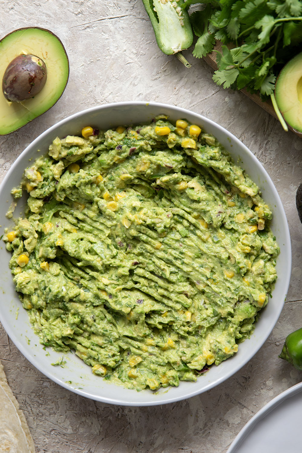 These ground beef quesadillas feature a cheesy ground beef black bean filling and lots of sweet corn guacamole for dipping.