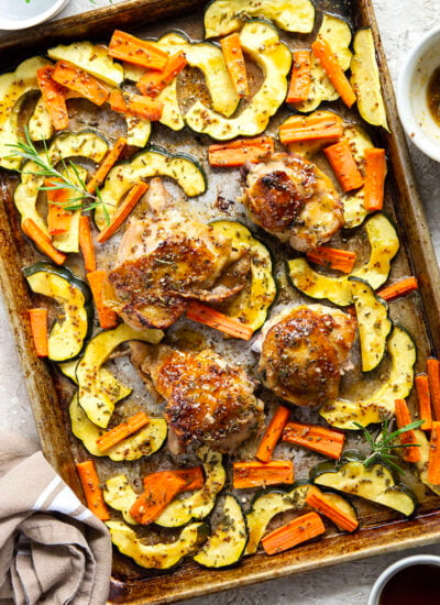 Baked in a sweet and flavorful maple dijon sauce with tender fall veggies, these maple dijon chicken thighs are a quick weeknight dinner that everyone always loves!