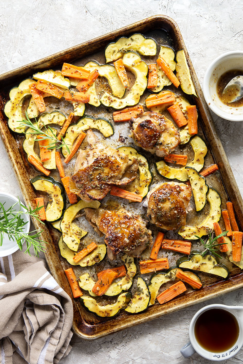 Baked in a sweet and flavorful maple dijon sauce with tender fall veggies, these maple dijon chicken thighs are a quick weeknight dinner that everyone always loves!