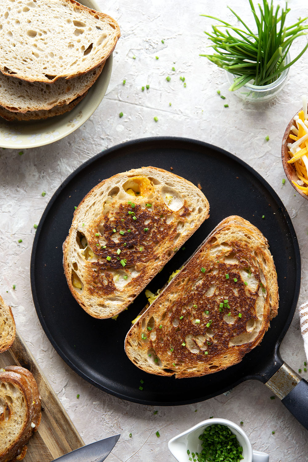 This breakfast-style scrambled egg grilled cheese is loaded to the max with scrambled eggs and two kinds of gooey cheese.
