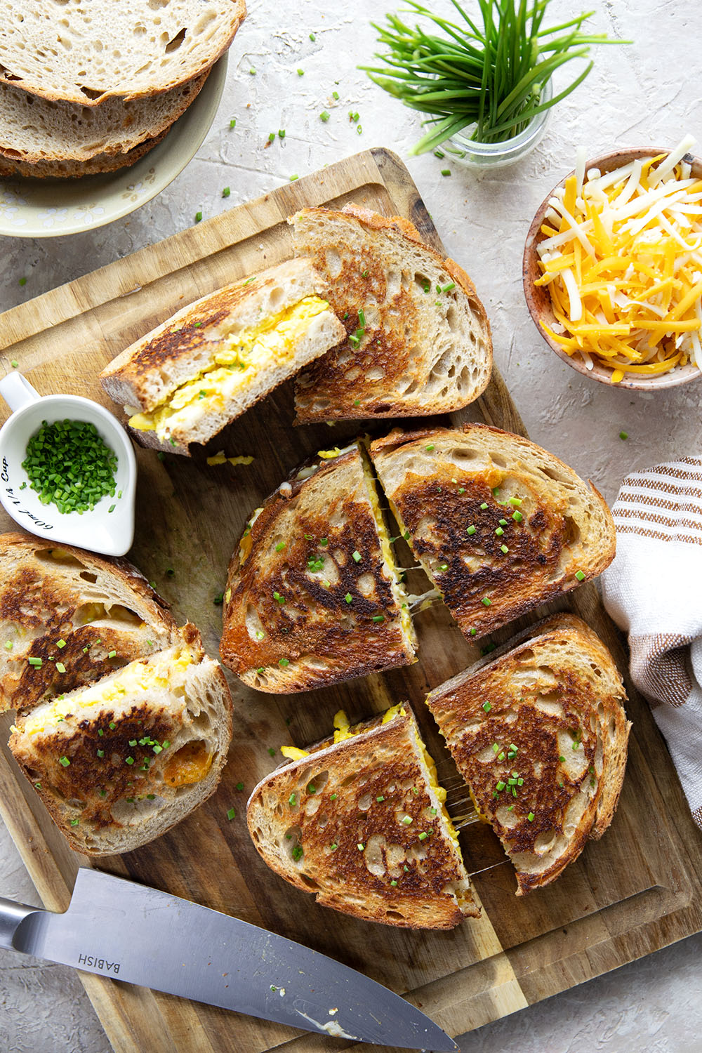 This breakfast-style scrambled egg grilled cheese is loaded to the max with scrambled eggs and two kinds of gooey cheese.