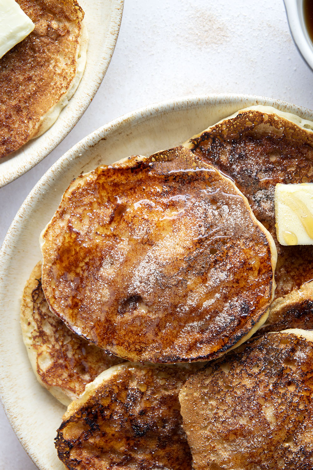 Love snickerdoodle cookies? You'll adore these snickerdoodle pancakes that feature a fluffy buttermilk pancake base with cinnamon sugar caramelized on the outside.