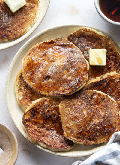 Love snickerdoodle cookies? You'll adore these snickerdoodle pancakes that feature a fluffy buttermilk pancake base with cinnamon sugar caramelized on the outside.