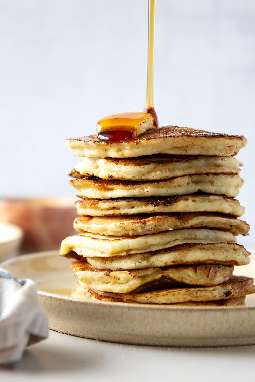 Love snickerdoodle cookies? You'll adore these snickerdoodle pancakes that feature a fluffy buttermilk pancake base with cinnamon sugar caramelized on the outside.