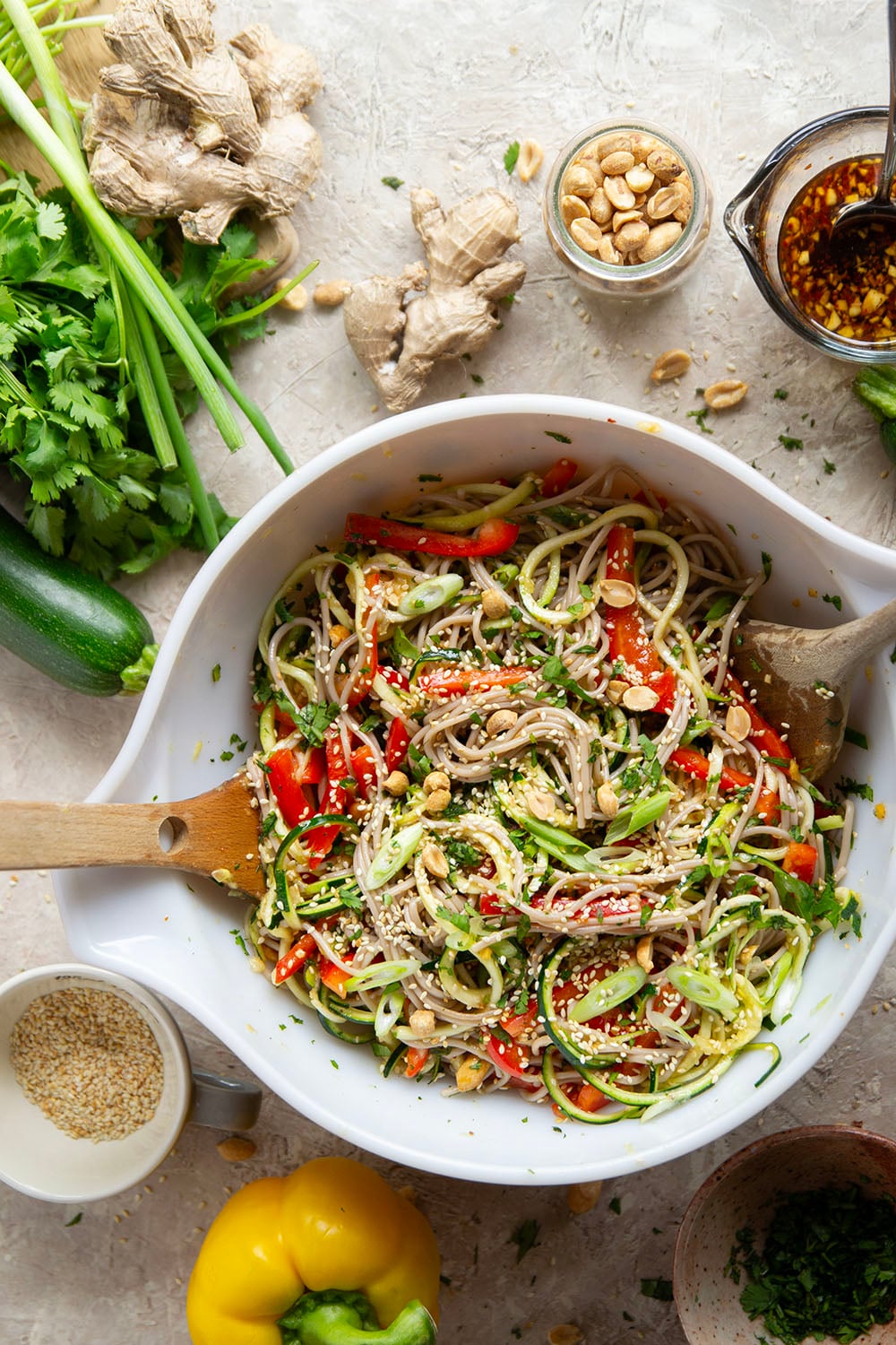 Zucchini and soba noodles are the perfect salad base in this zucchini soba noodle salad that features crunchy sweet peppers, lots of fresh herbs, and a flavorful fresh ginger sesame dressing.