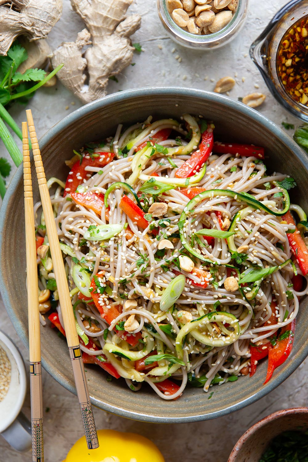 Zucchini and soba noodles are the perfect salad base in this zucchini soba noodle salad that features crunchy sweet peppers, lots of fresh herbs, and a flavorful fresh ginger sesame dressing.
