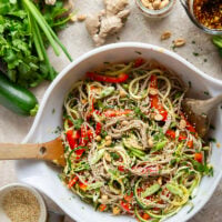 Zucchini and soba noodles are the perfect salad base in this zucchini soba noodle salad that features crunchy sweet peppers, lots of fresh herbs, and a flavorful fresh ginger sesame dressing.