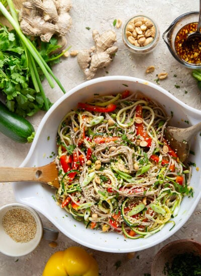 Zucchini and soba noodles are the perfect salad base in this zucchini soba noodle salad that features crunchy sweet peppers, lots of fresh herbs, and a flavorful fresh ginger sesame dressing.
