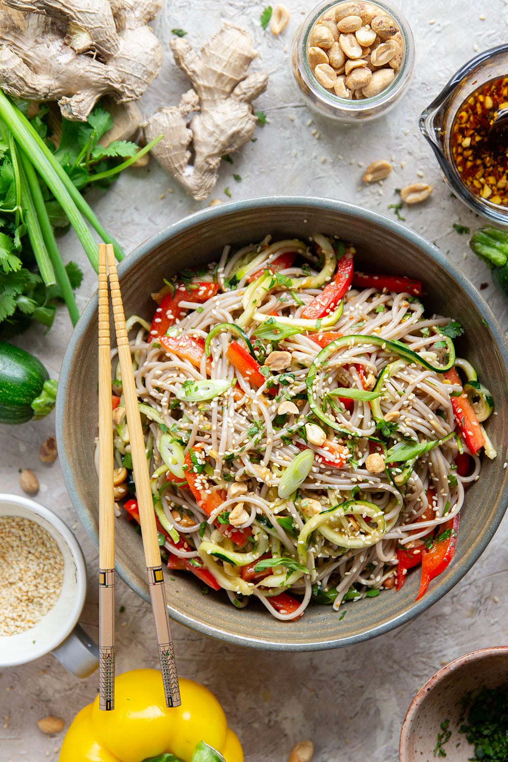 Zucchini and soba noodles are the perfect salad base in this zucchini soba noodle salad that features crunchy sweet peppers, lots of fresh herbs, and a flavorful fresh ginger sesame dressing.