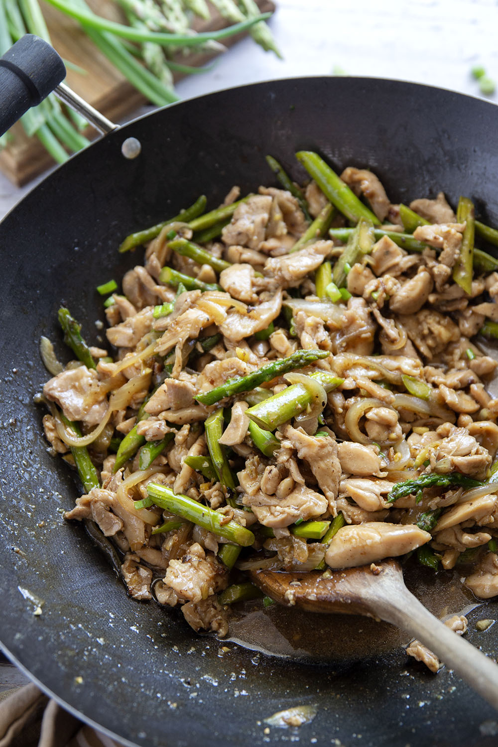 Dinner's on in only 30 minutes with this simple asparagus and chicken stir fry! Tender asparagus and juicy chicken are stir fried in minutes in a quick and flavorful soy ginger garlic sauce.
