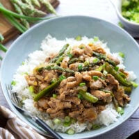 Dinner's on in only 30 minutes with this simple asparagus and chicken stir fry! Tender asparagus and juicy chicken are stir fried in minutes in a quick and flavorful soy ginger garlic sauce.
