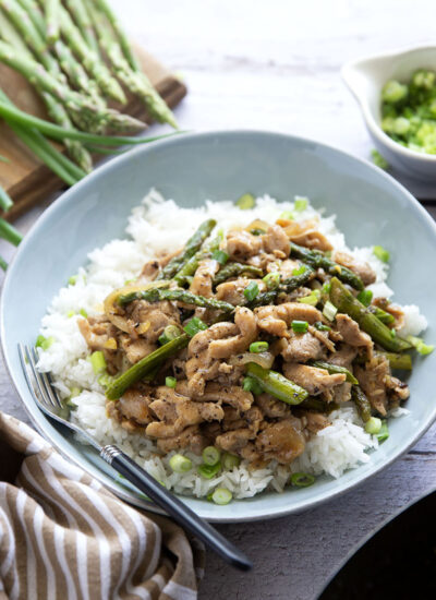 Dinner's on in only 30 minutes with this simple asparagus and chicken stir fry! Tender asparagus and juicy chicken are stir fried in minutes in a quick and flavorful soy ginger garlic sauce.