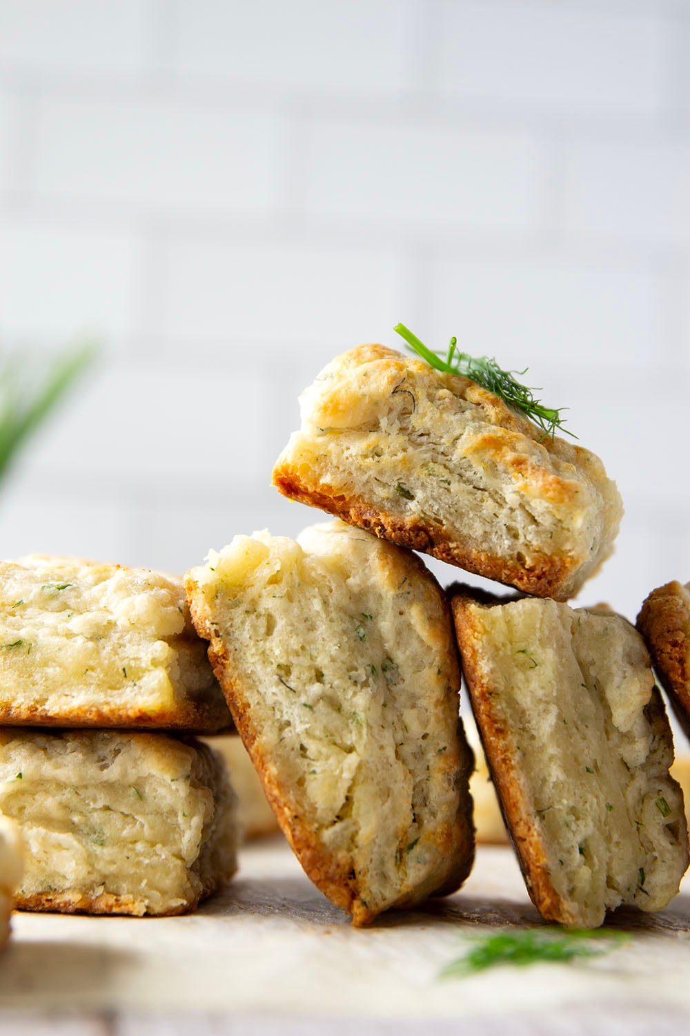 Fresh herbs and tangy Greek yogurt are a match made in heaven in these flaky Greek yogurt biscuits! Crack them open warm from the oven and top with lots of butter.