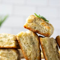 Fresh herbs and tangy Greek yogurt are a match made in heaven in these flaky Greek yogurt biscuits! Crack them open warm from the oven and top with lots of butter.