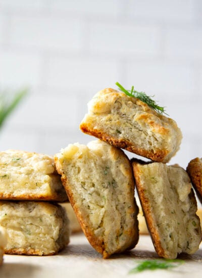 Fresh herbs and tangy Greek yogurt are a match made in heaven in these flaky Greek yogurt biscuits! Crack them open warm from the oven and top with lots of butter.