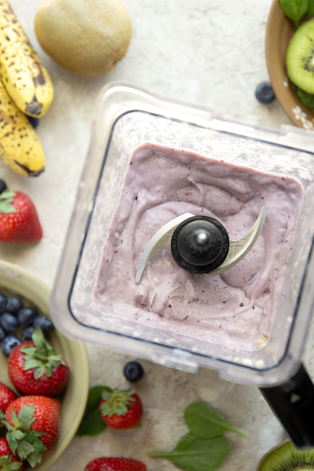 A double layer of mixed berries and vibrant green ingredients comes together in this protein-packed berry green smoothie that you can feel good about sipping!