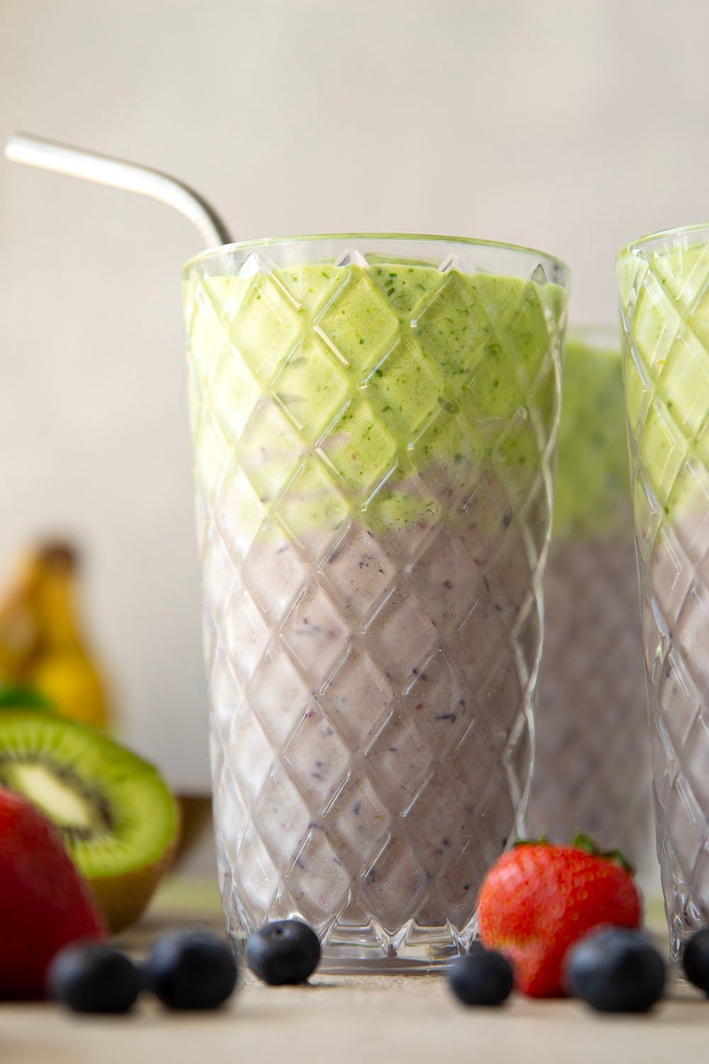 A double layer of mixed berries and vibrant green ingredients comes together in this protein-packed berry green smoothie that you can feel good about sipping!