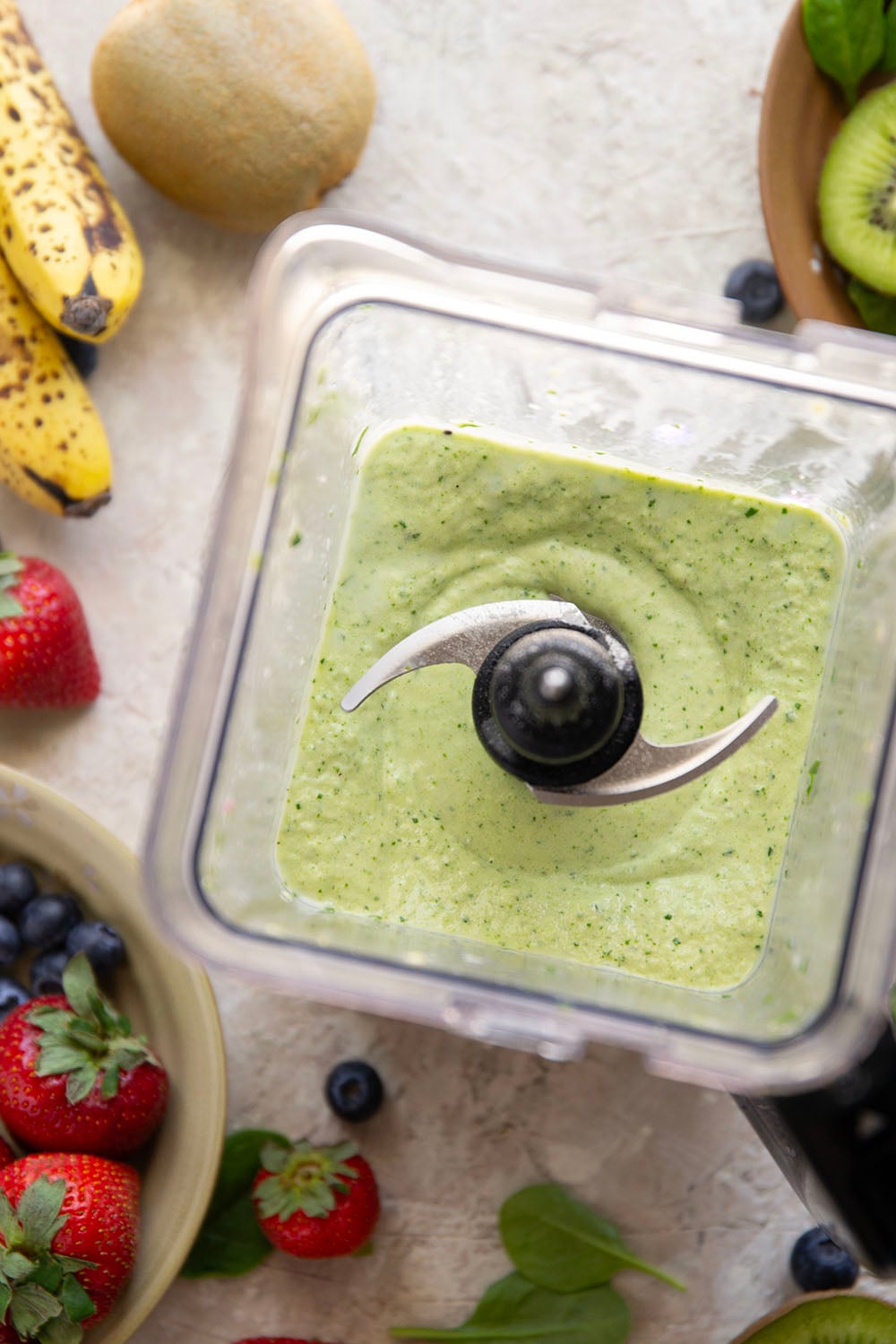 A double layer of mixed berries and vibrant green ingredients comes together in this protein-packed berry green smoothie that you can feel good about sipping!