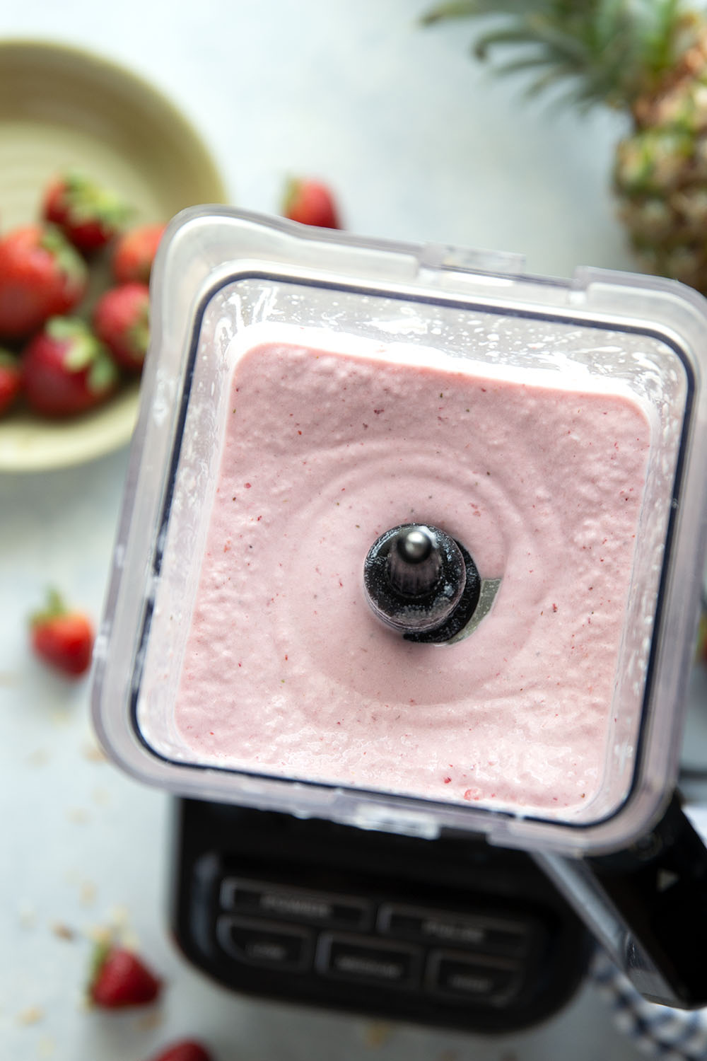 This creamy pina colada smoothie will make you feel like you took a trip to the tropics! Packed with lots of fruit, coconut flavor, and a big protein boost as well.