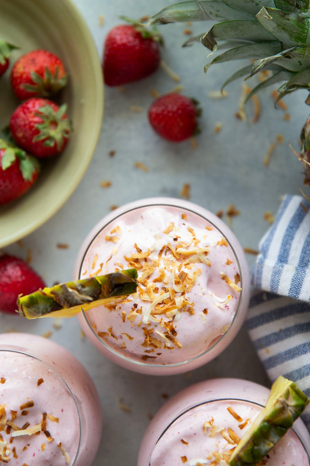 This creamy pina colada smoothie will make you feel like you took a trip to the tropics! Packed with lots of fruit, coconut flavor, and a big protein boost as well.