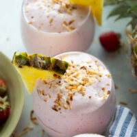This creamy piña colada smoothie will make you feel like you took a trip to the tropics! Packed with lots of fruit, coconut flavor, and a big protein boost as well.