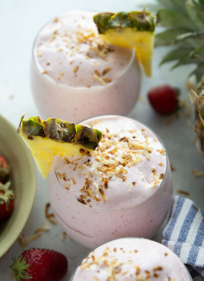 This creamy piña colada smoothie will make you feel like you took a trip to the tropics! Packed with lots of fruit, coconut flavor, and a big protein boost as well.