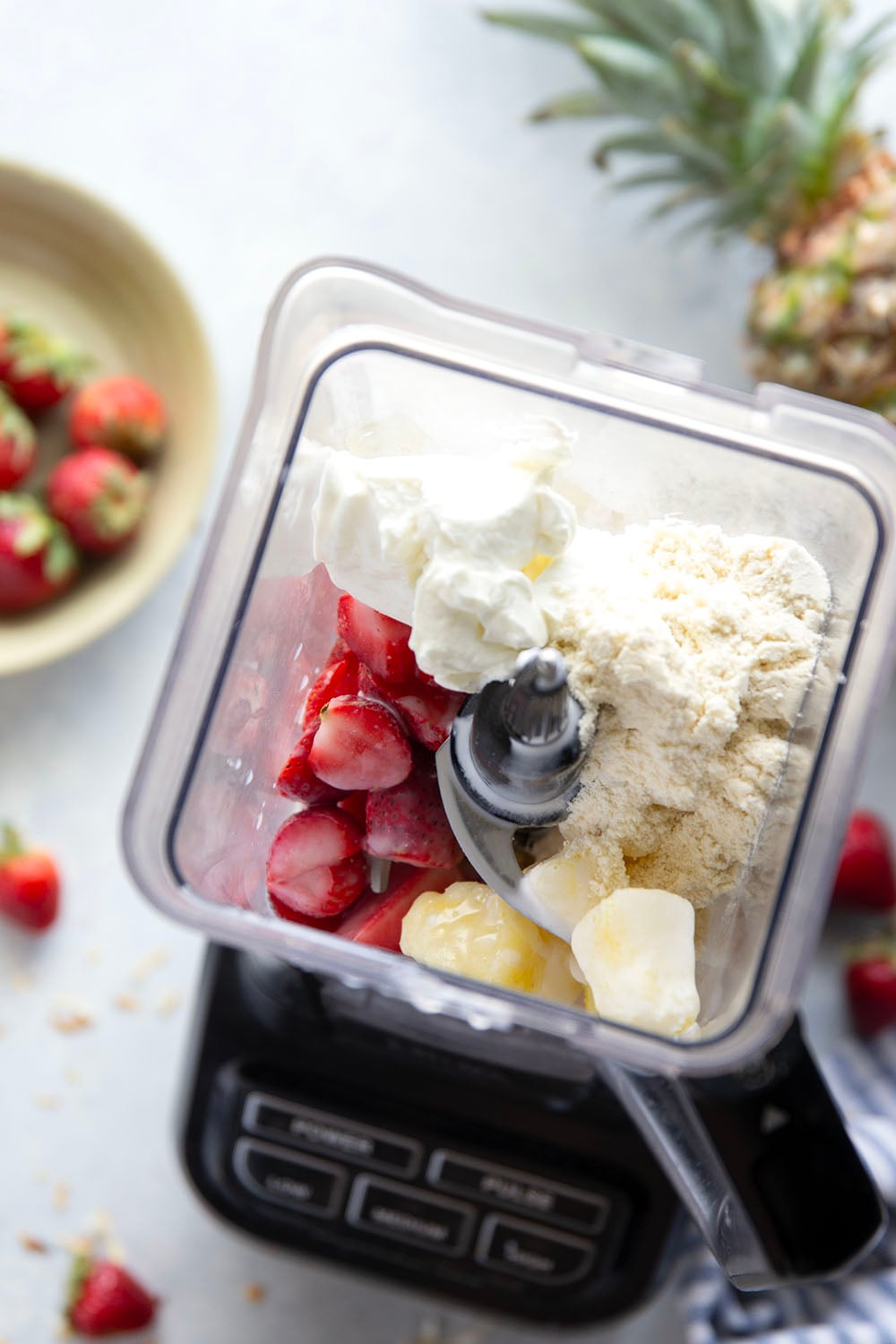 This creamy pina colada smoothie will make you feel like you took a trip to the tropics! Packed with lots of fruit, coconut flavor, and a big protein boost as well.
