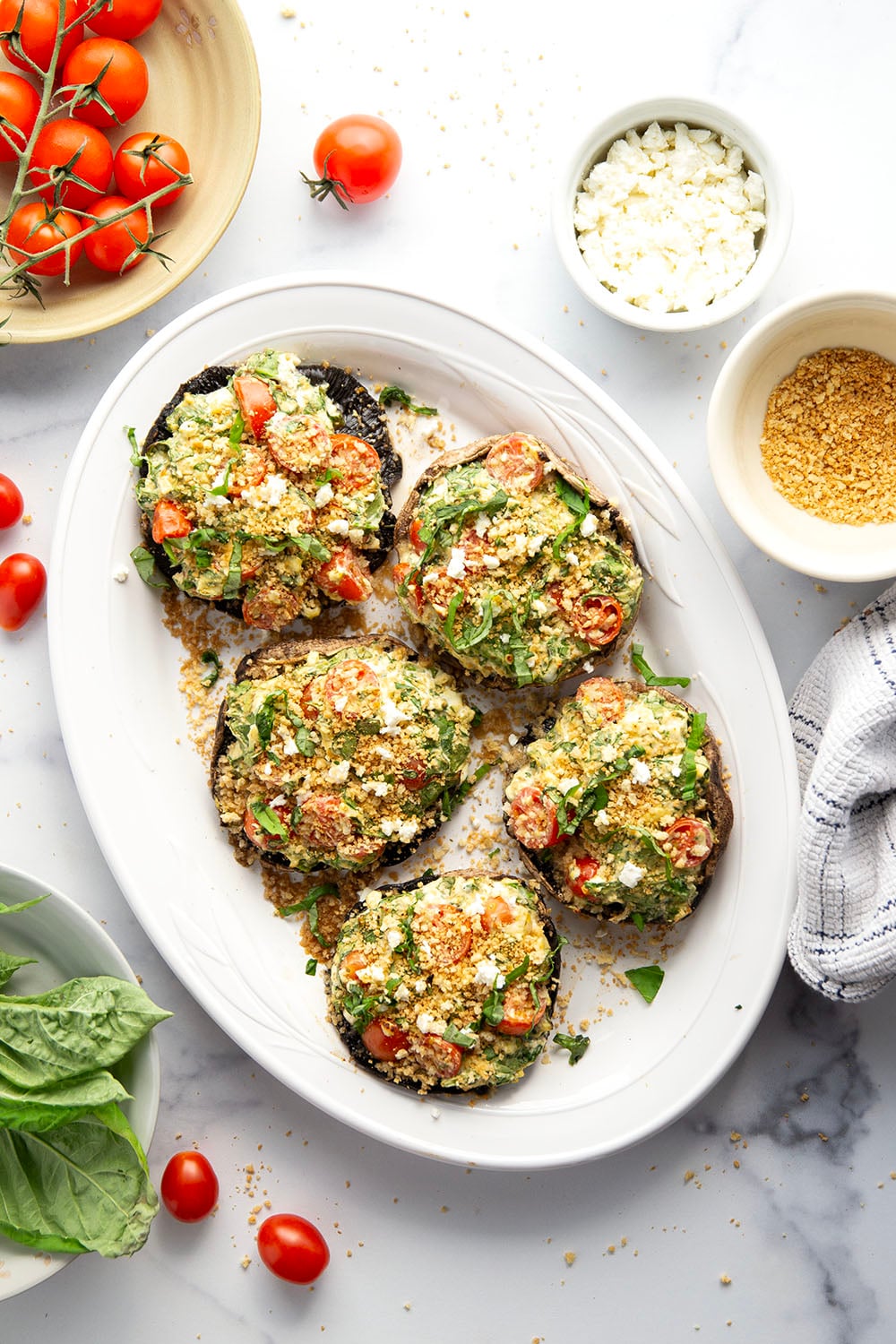 These stuffed portobello mushrooms include a fresh cherry tomato spinach feta filling stuffed into tender portobello caps and grilled for just a few minutes until perfectly tender and smoky.