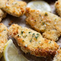 Oven fried to perfection until perfectly crispy and drizzled with a fresh lemon garlic butter, these lemon chicken tenders are always a dinner favorite.