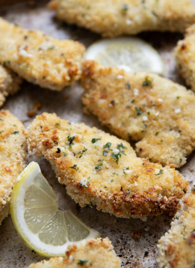 Oven fried to perfection until perfectly crispy and drizzled with a fresh lemon garlic butter, these lemon chicken tenders are always a dinner favorite.