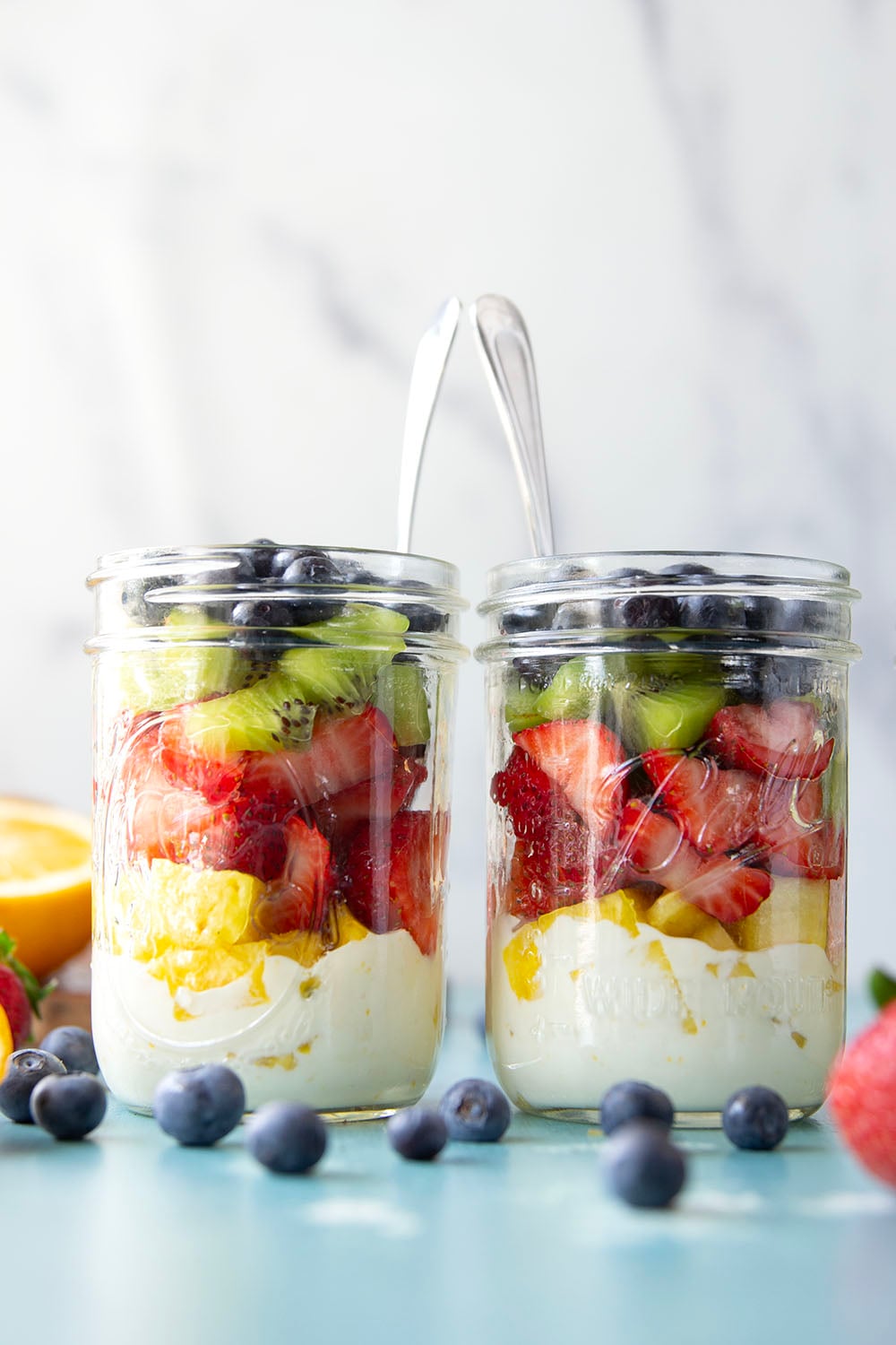 Take your fruit salad along to those summer picnics the easy way! Layer it up rainbow-style in a jar with a creamy citrus yogurt dressing. This layered fruit salad will quickly become a summer favorite.