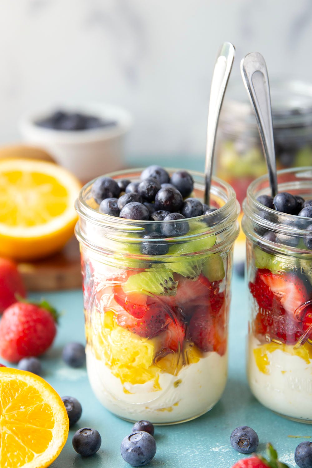Take your fruit salad along to those summer picnics the easy way! Layer it up rainbow-style in a jar with a creamy citrus yogurt dressing. This layered fruit salad will quickly become a summer favorite.