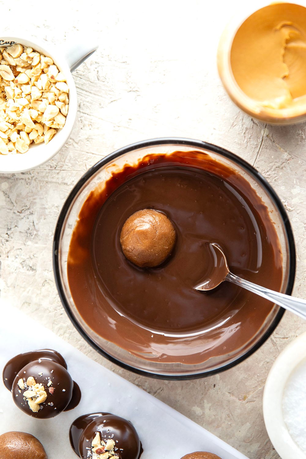 These protein peanut butter balls take only a handful of ingredients to throw together and taste exactly like a peanut butter cup!