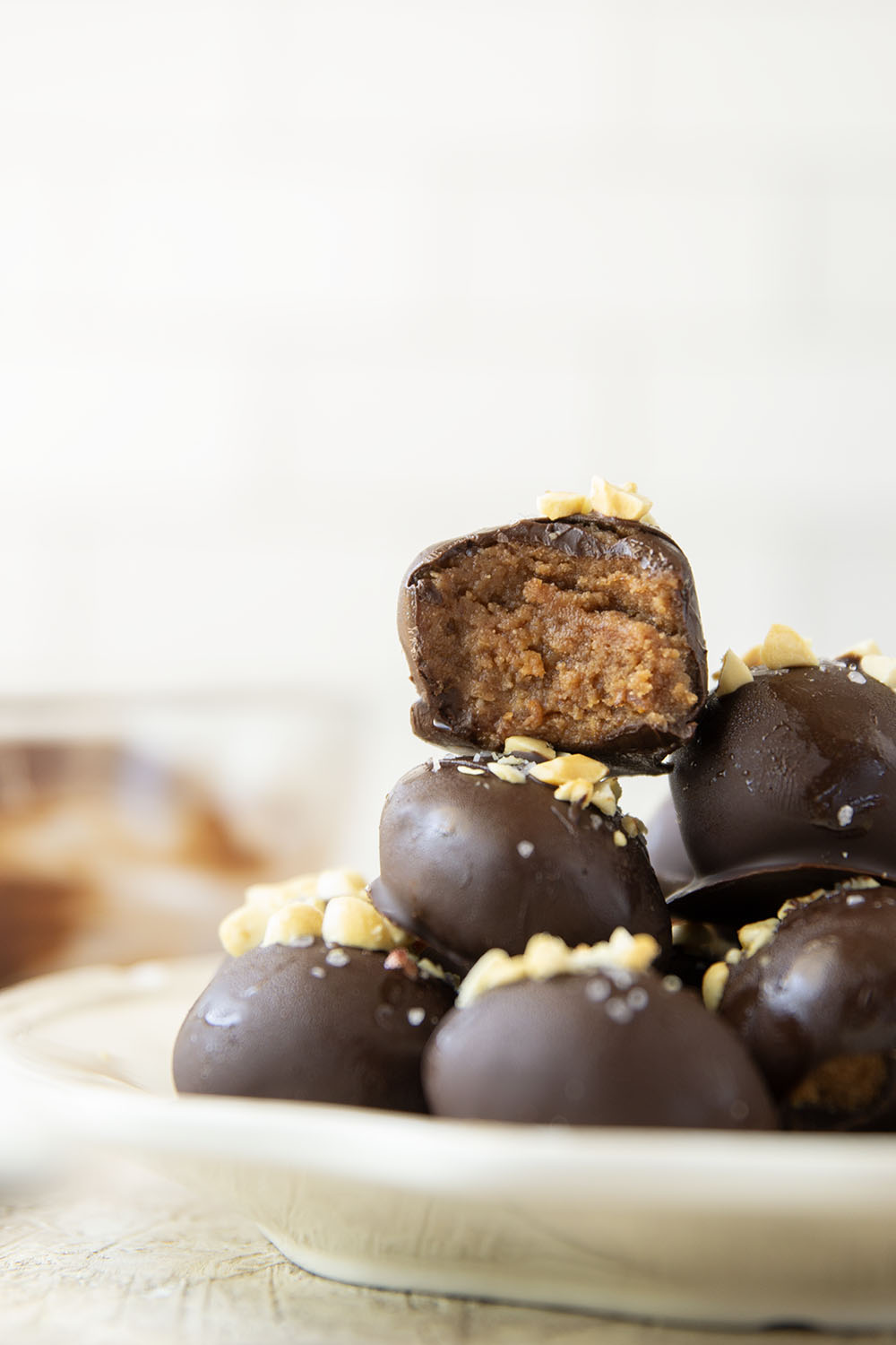These protein peanut butter balls take only a handful of ingredients to throw together and taste exactly like a peanut butter cup!