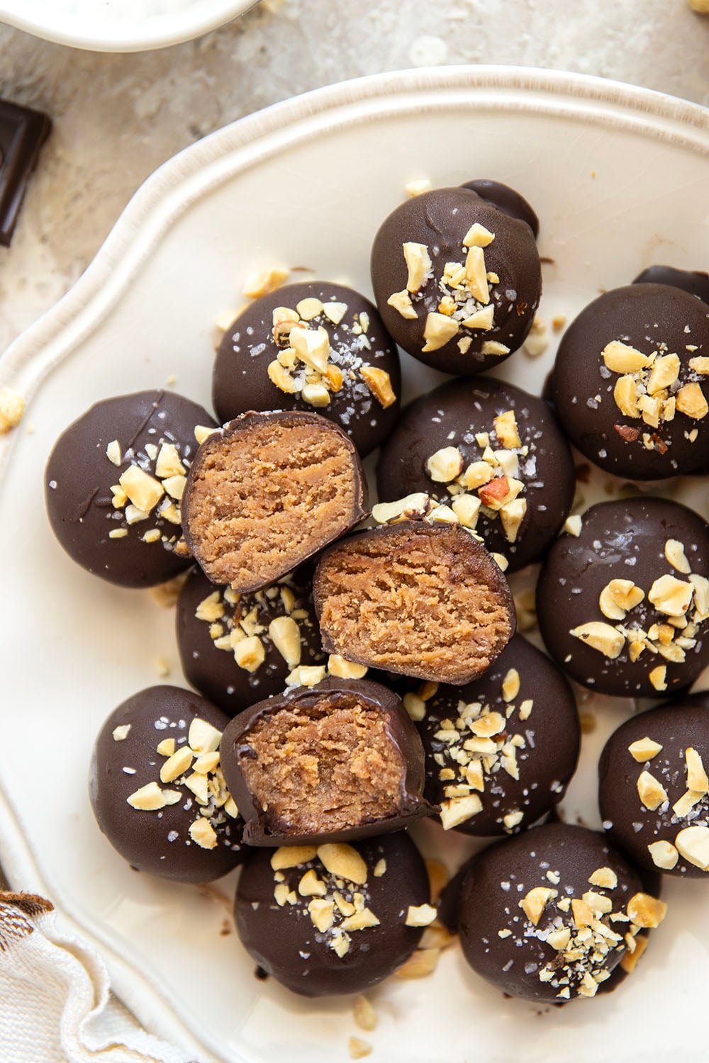 These protein peanut butter balls take only a handful of ingredients to throw together and taste exactly like a peanut butter cup!