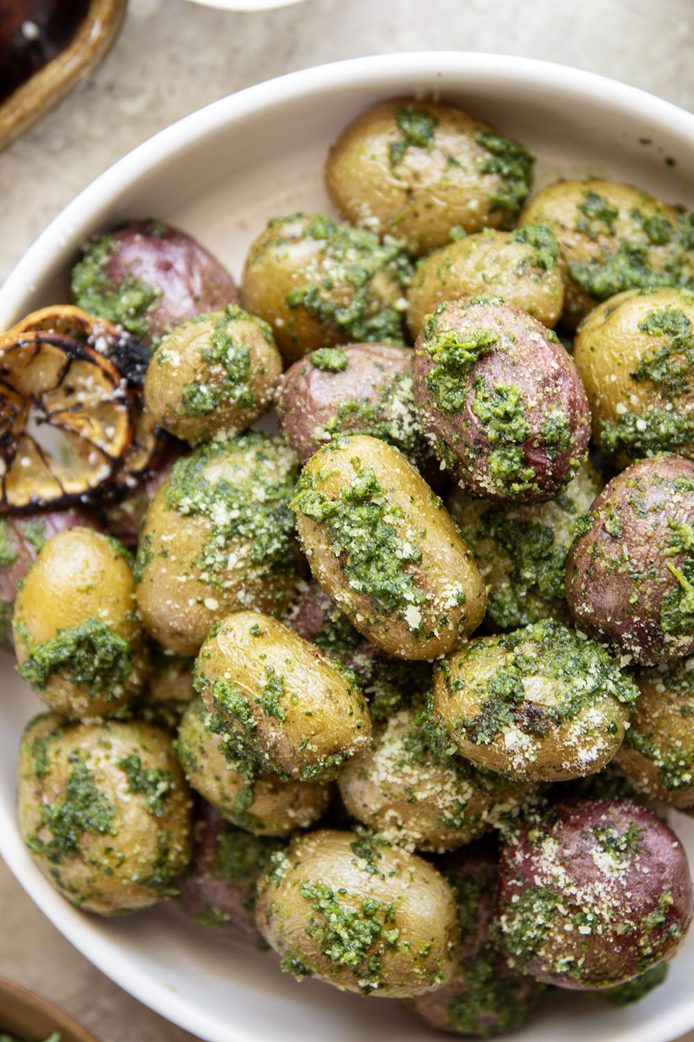 These pesto roasted potatoes feature tender, crispy roasted fingerling potatoes tossed in a homemade lemon kale pesto.