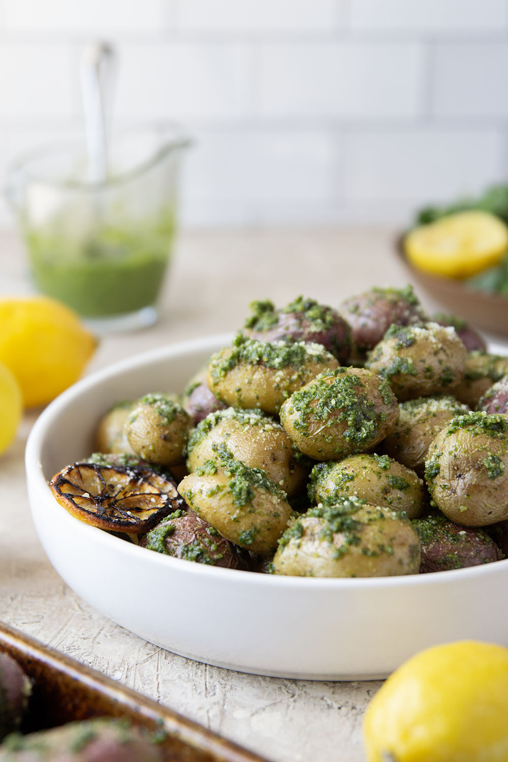 These pesto roasted potatoes feature tender, crispy roasted fingerling potatoes tossed in a homemade lemon kale pesto.