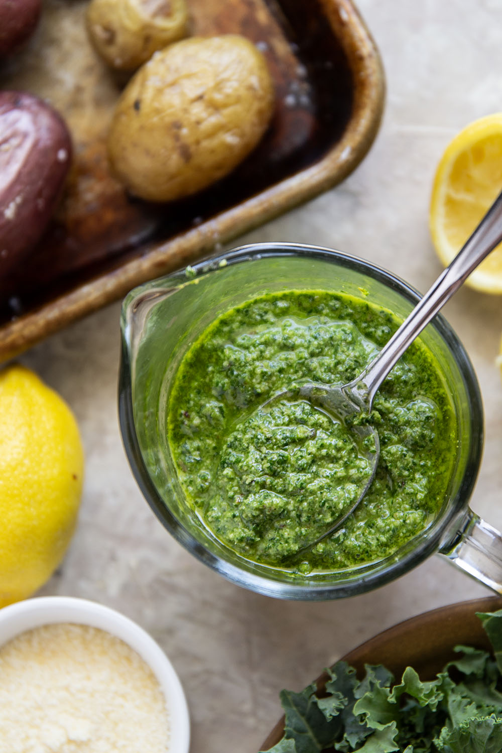 These pesto roasted potatoes feature tender, crispy roasted fingerling potatoes tossed in a homemade lemon kale pesto.