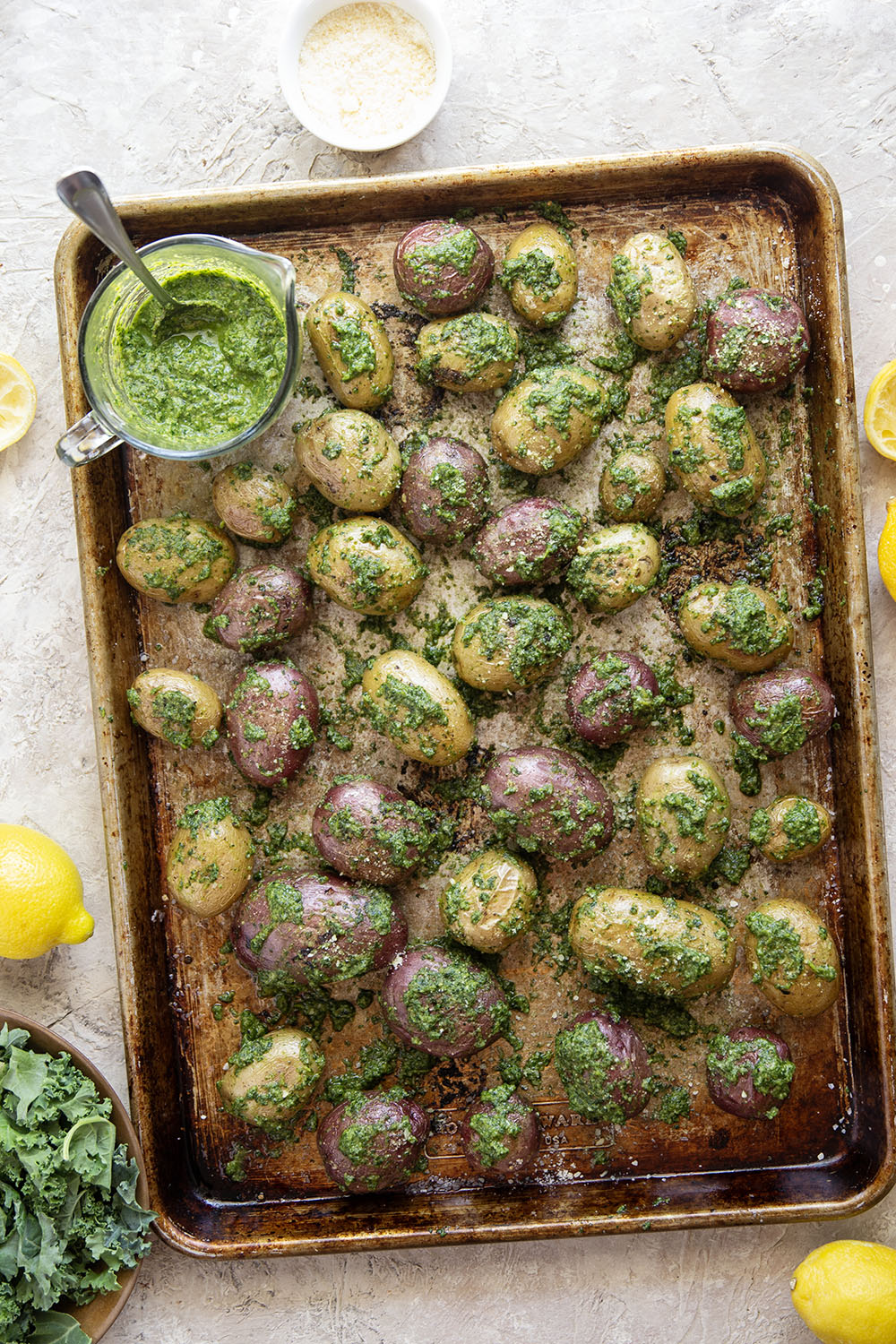 These pesto roasted potatoes feature tender, crispy roasted fingerling potatoes tossed in a homemade lemon kale pesto.