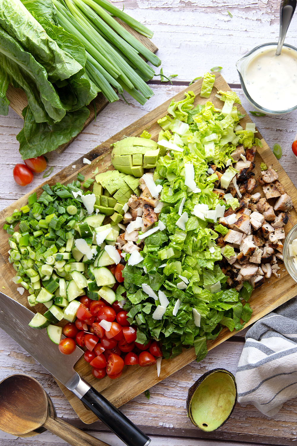 Smoky grilled chicken thighs, silky avocado cubes, cherry tomatoes, and a homemade buttermilk ranch dressing take this ranch chicken chopped salad to another level!